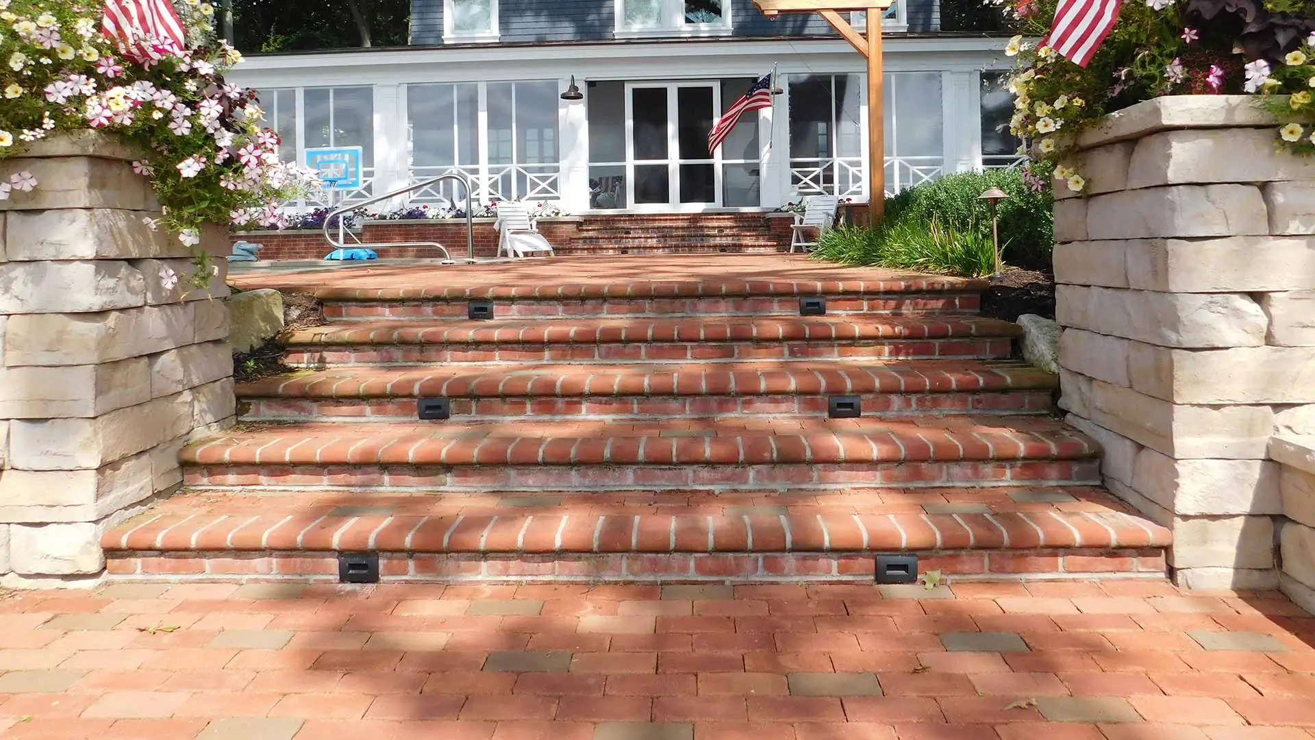 Custom brick stairs and retaining wall installed at a Hudsonville, MI home.