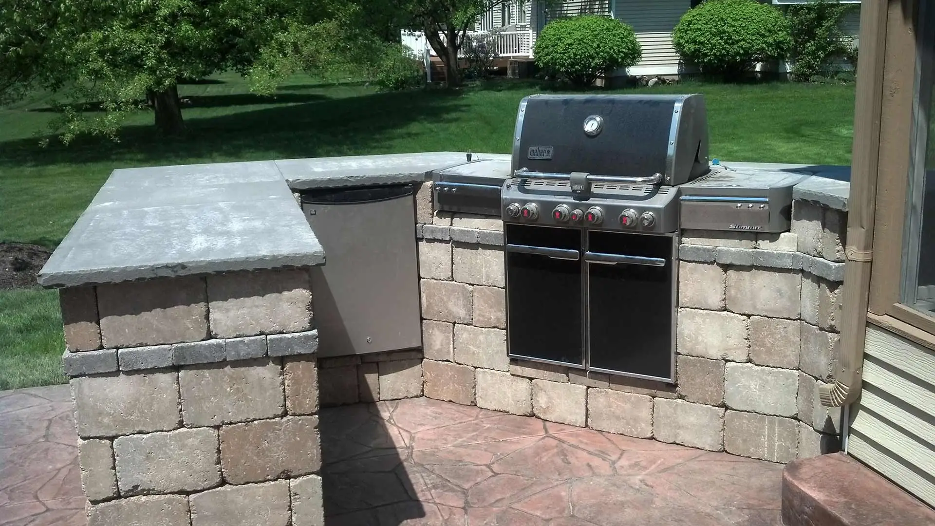 Custom outdoor kitchen living area constructed in Comstock Park, MI.