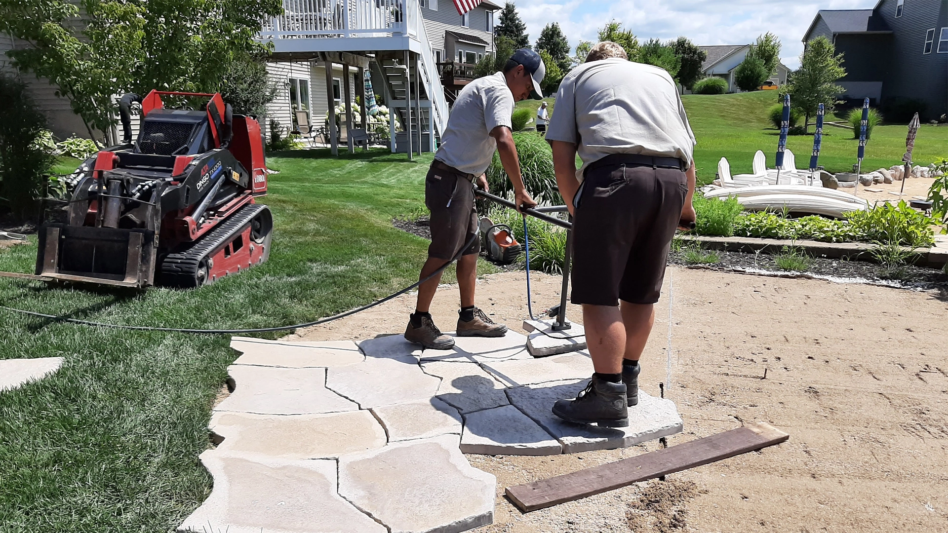 Our team of highly trained landscape professionals installing a new pathway.