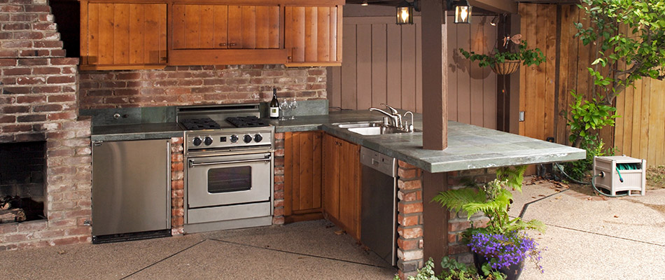 A brown brick outdoor kitchen built on a property in Grand Rapids, MI.