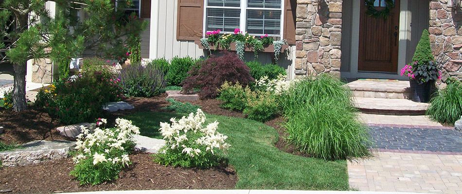 Colorful plantings installed for landscape bed in Marne, MI.