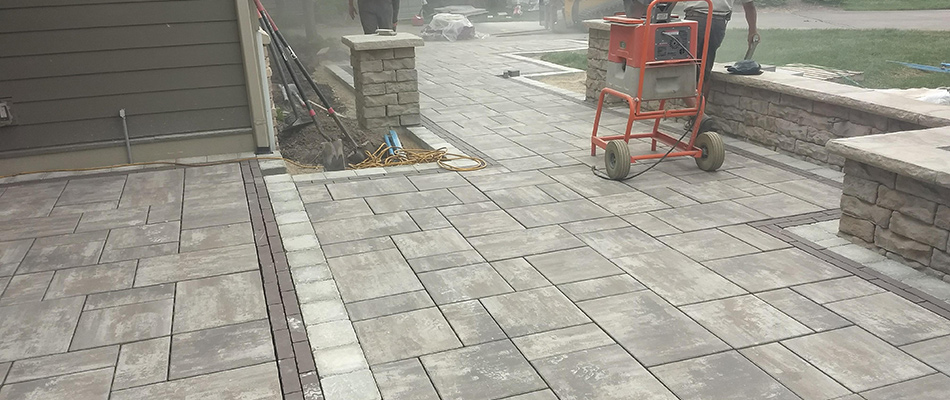 Hardscape company building a patio from scratch and nearly complete near Ada, MI.
