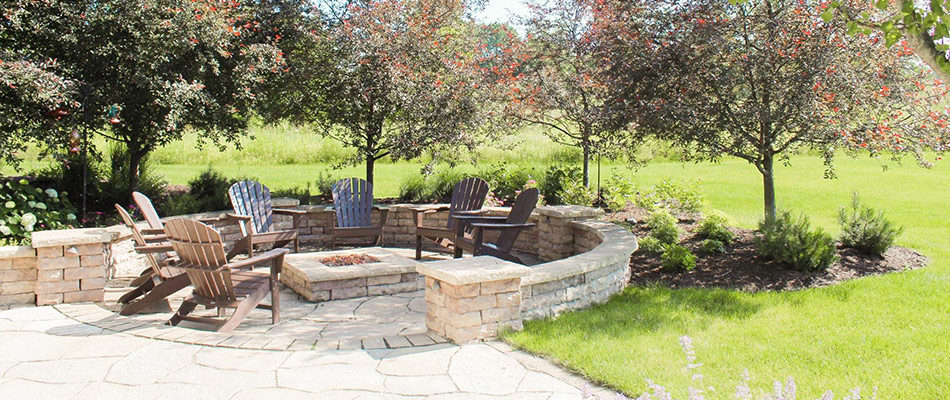 Paved patio with firepit installed in Cedar Springs, MI.